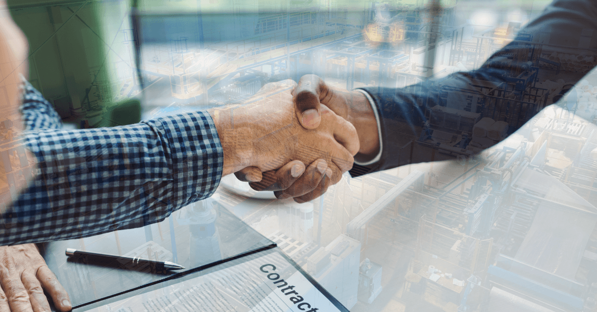 Image of two people shaking hands in agreement with an underlaying faded image of a factory